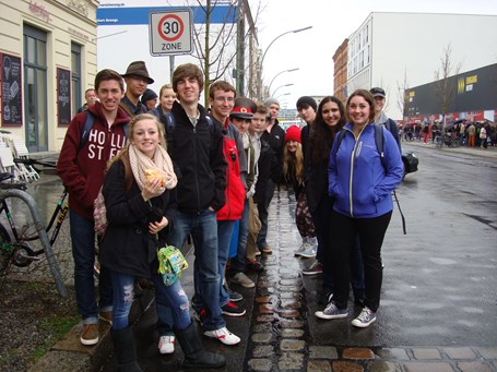Students standing on either side of the bricks to mark where the wall stood.   2014