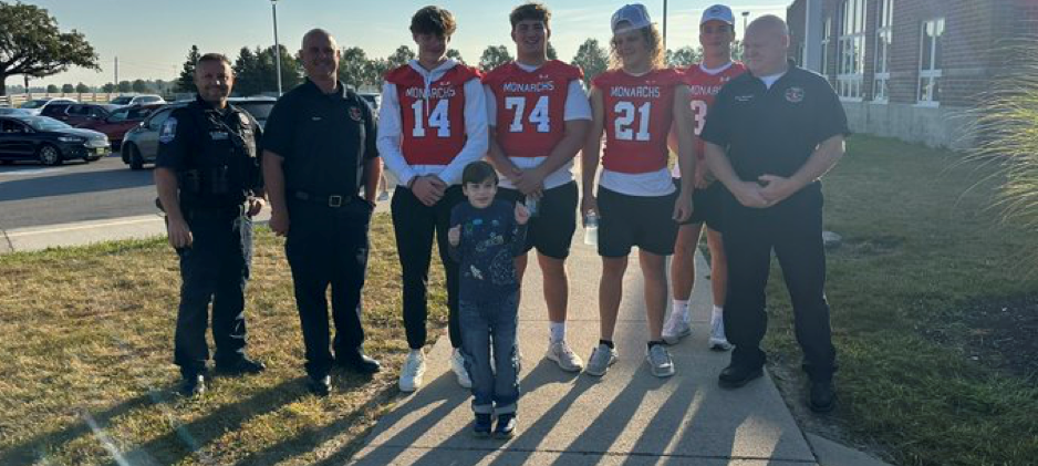 Student excited to meet football players, firefighters and police officer.
